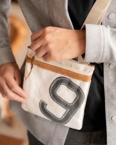 Travel cross-body bag · Leather and linen