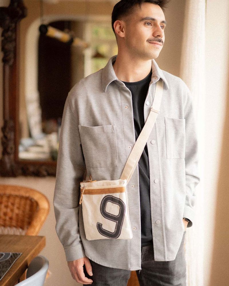 Travel cross-body bag · Leather and linen